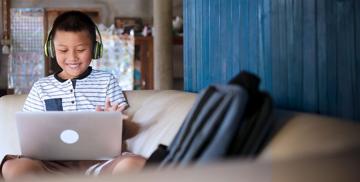 A child working on a laptop